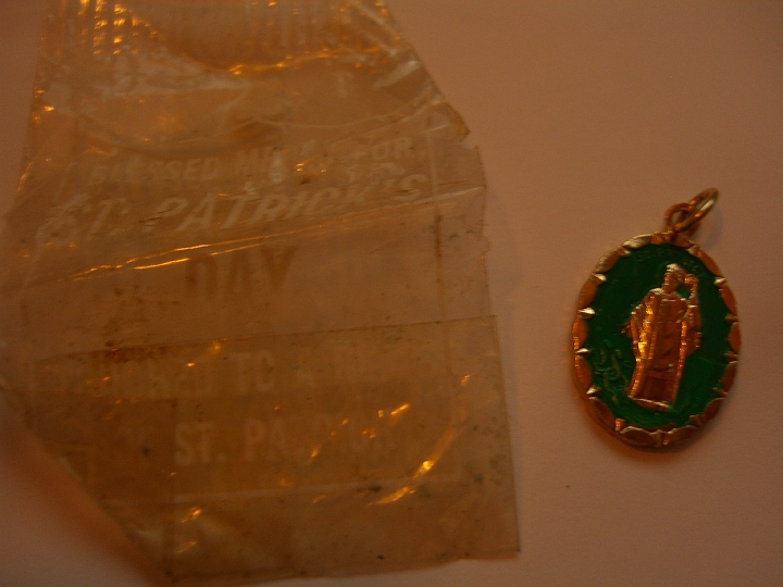 CIMG2142.JPG - I bought some vintage tea tins on eBay and this tiny St. Patrick medal was in one of them. In another shot you can read what it says on the wrapper.