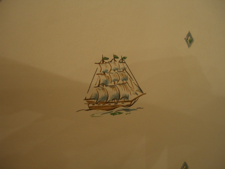 CIMG1965.JPG - This was the wallpaper in the master bathroom. I was confused about whether the pennants would actually point that way, with the wind, were a ship under full sail.