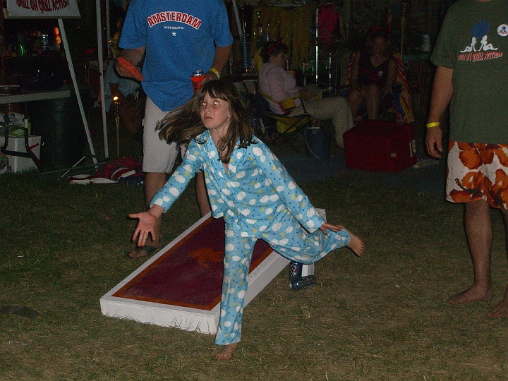 CIMG2266.JPG - Neva can't QUITE throw far enough to play a good game of cornhole, but she gave it her all.