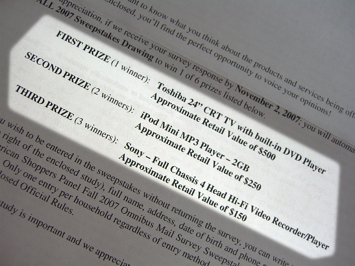 CIMG2605.JPG - Prizes in a mail survey I just got. Apparently these prizes have been lying around for a few years. I hope I don't win a VCR.