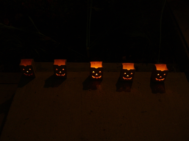 CIMG2743.JPG - Ceramic luminarias, found in the walled-in crawlspace in Lisa and David's basement a few months ago and seeing the light of a Halloween night for the first time since roughly 2000.