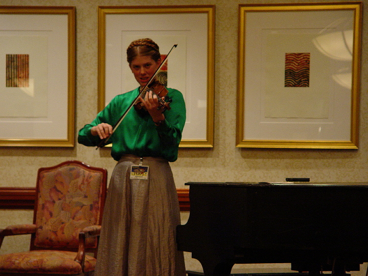 DSC02176.jpg - Fiddler April Grant outside the con suite